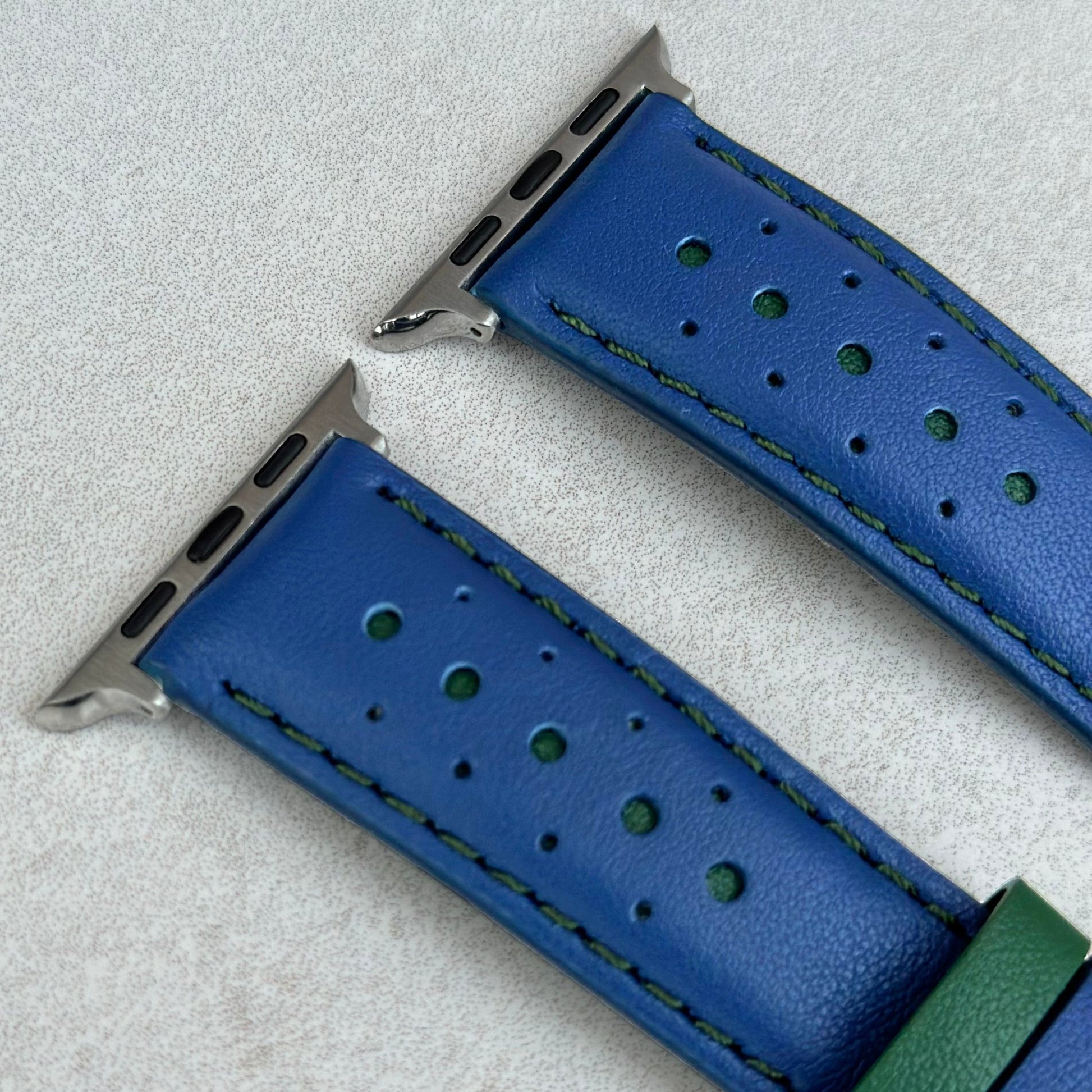 Padded apple watch strap. Cobalt blue and forest green leather. Green stitching, stainless steel apple watch connectors.