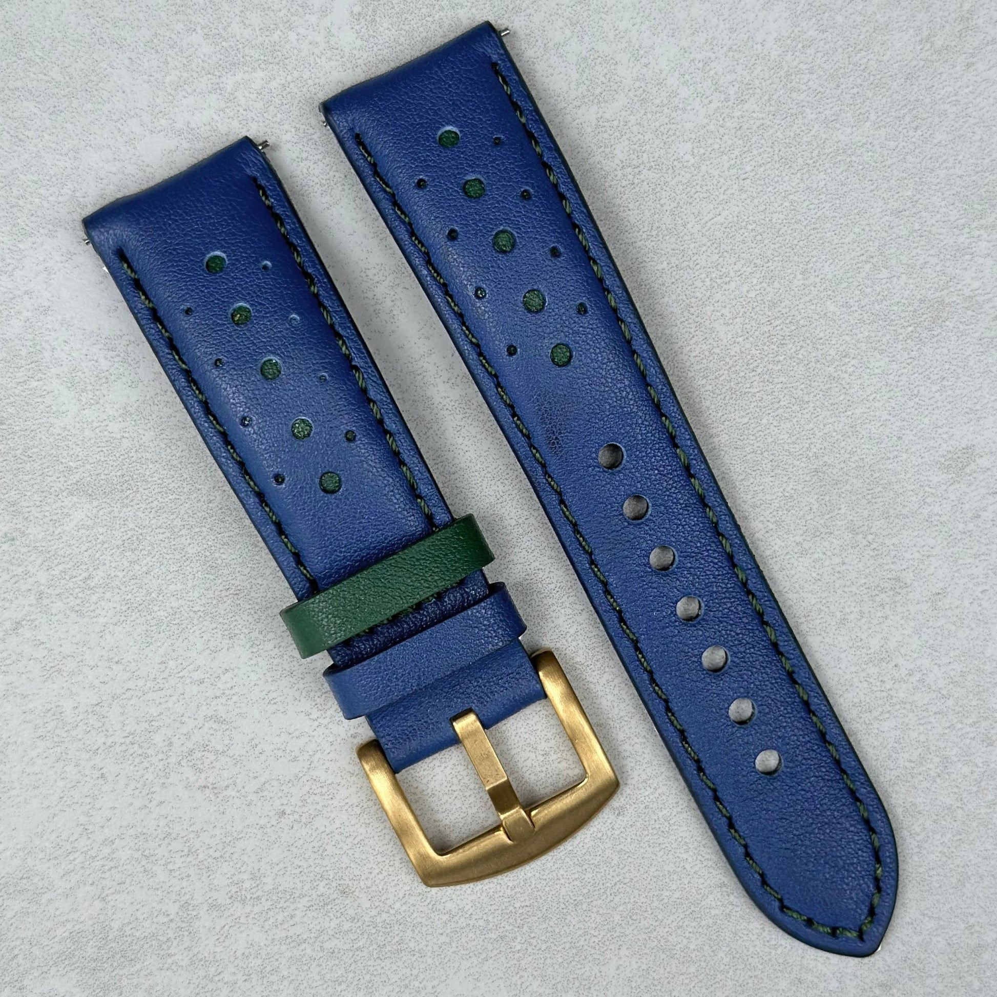 Le Mans blue and green full grain leather racing watch strap. Brushed PVD gold 316L stainless steel buckle.
