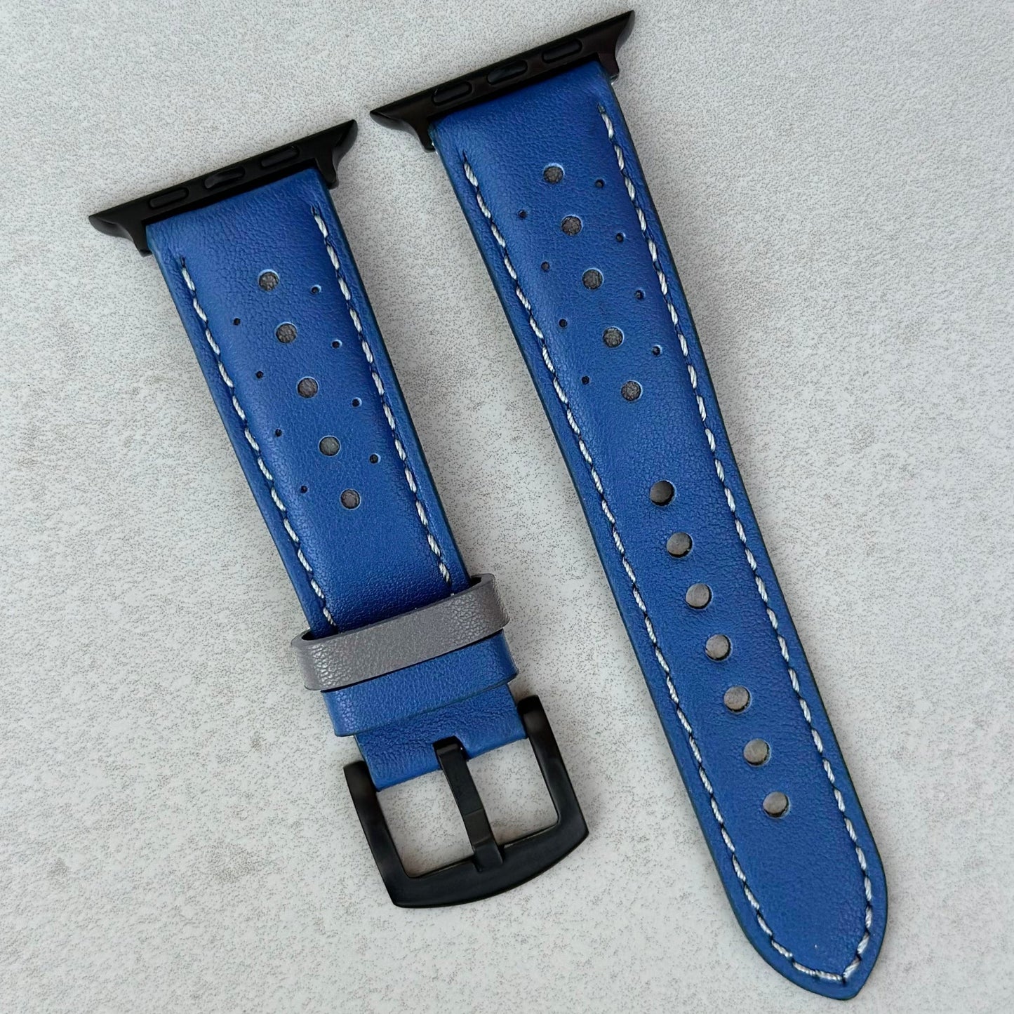 Le Mans blue and grey full grain leather racing apple watch strap. Black apple watch hardware.