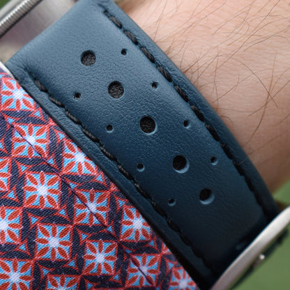 Wrist shot of the Le Mans dark petrol blue and black full grain leather racing watch strap. Placed on a males wrist.