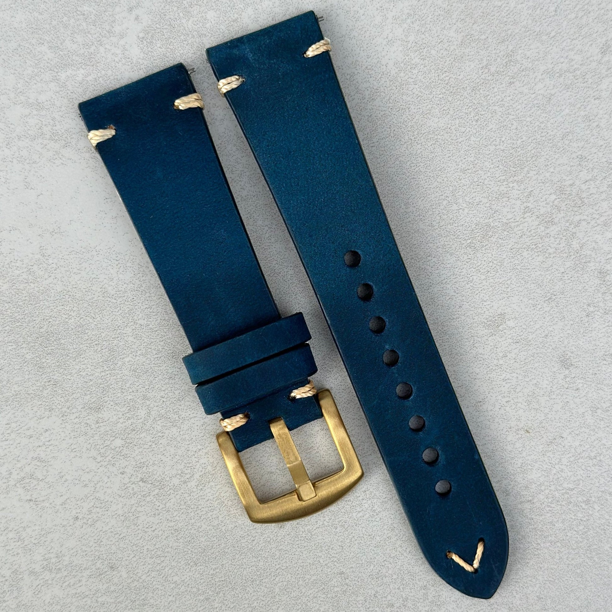 Madrid midnight blue full grain leather watch strap. PVD gold 316L stainless steel buckle. Contrast ivory stitching.