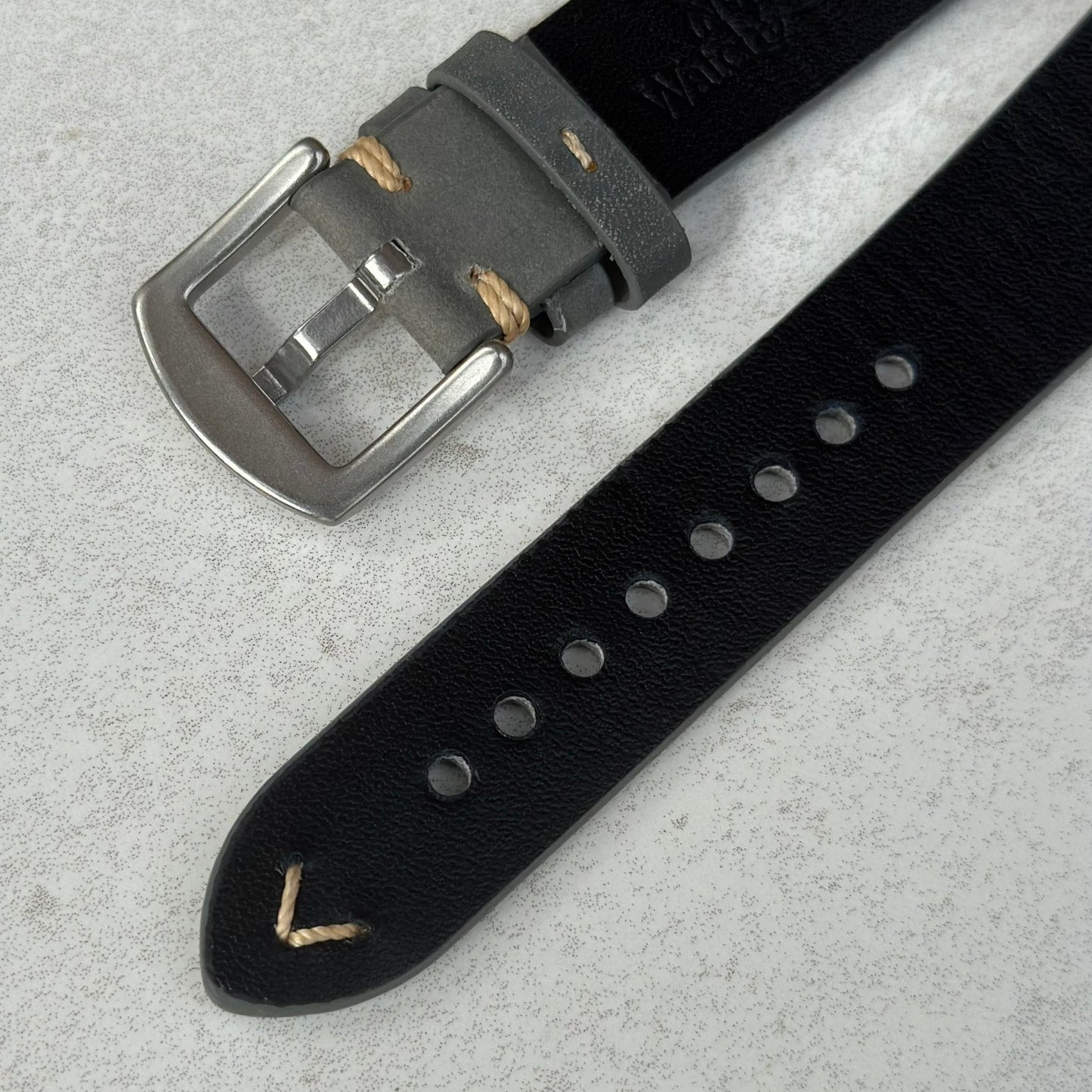 Underside of the 316L brushed stainless steel buckle on the Madrid grey horse leather watch strap. Watch And Strap