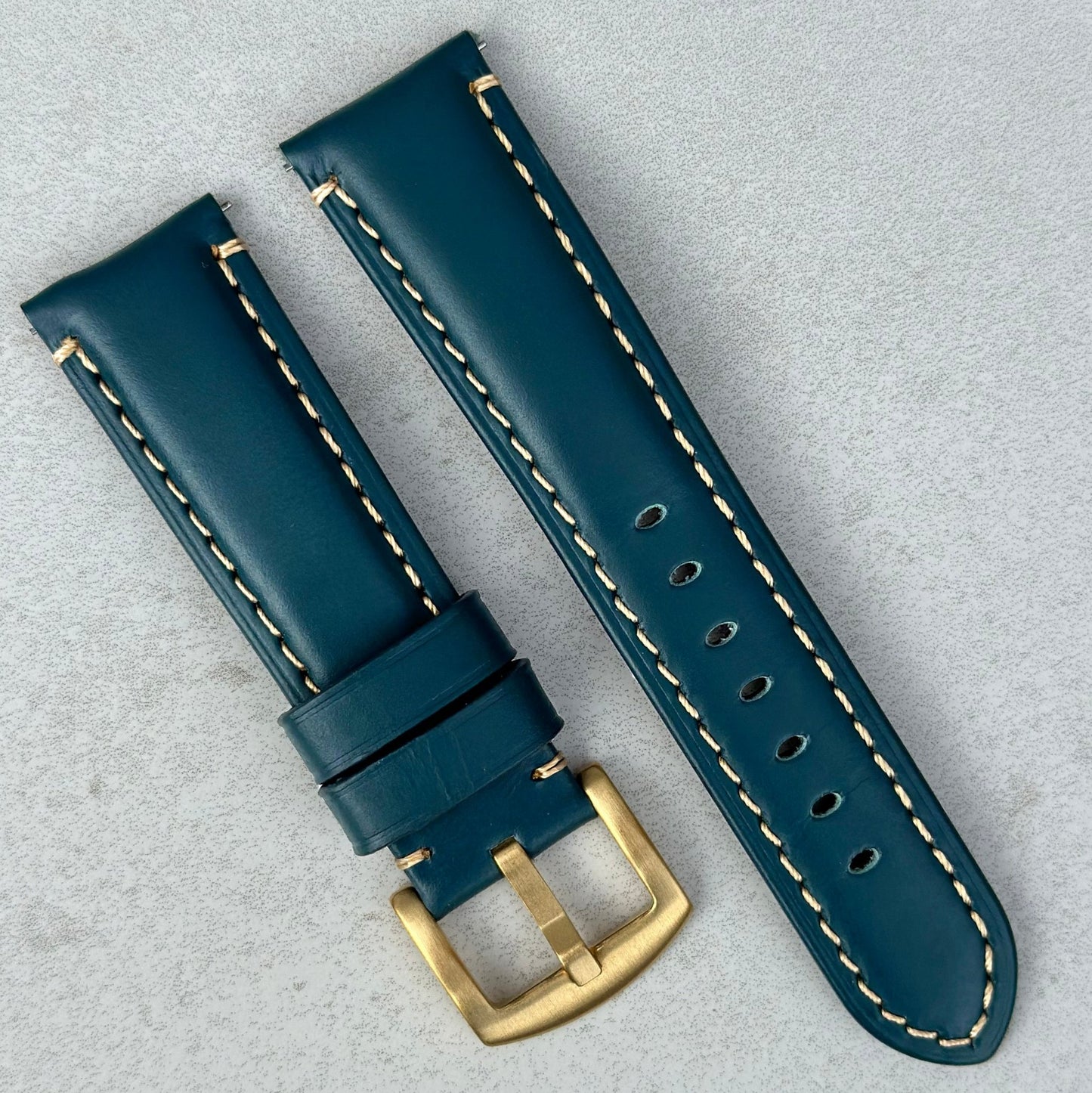 Oslo petrol blue leather watch strap with PVD gold 316L stainless steel buckle.