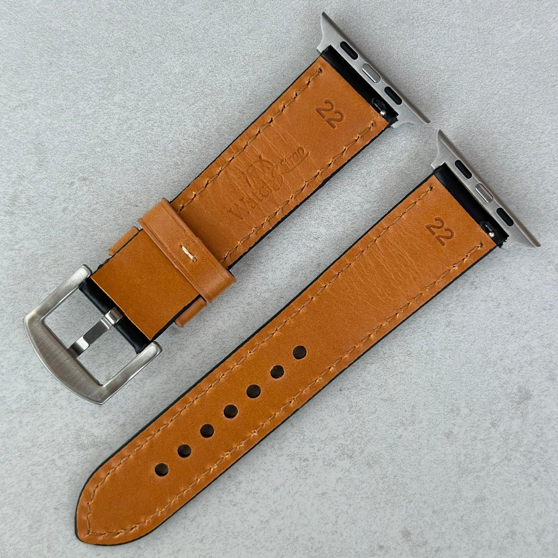 Rear of the Oxford black full grain leather watch strap. Tan underside. Watch And Strap logo.