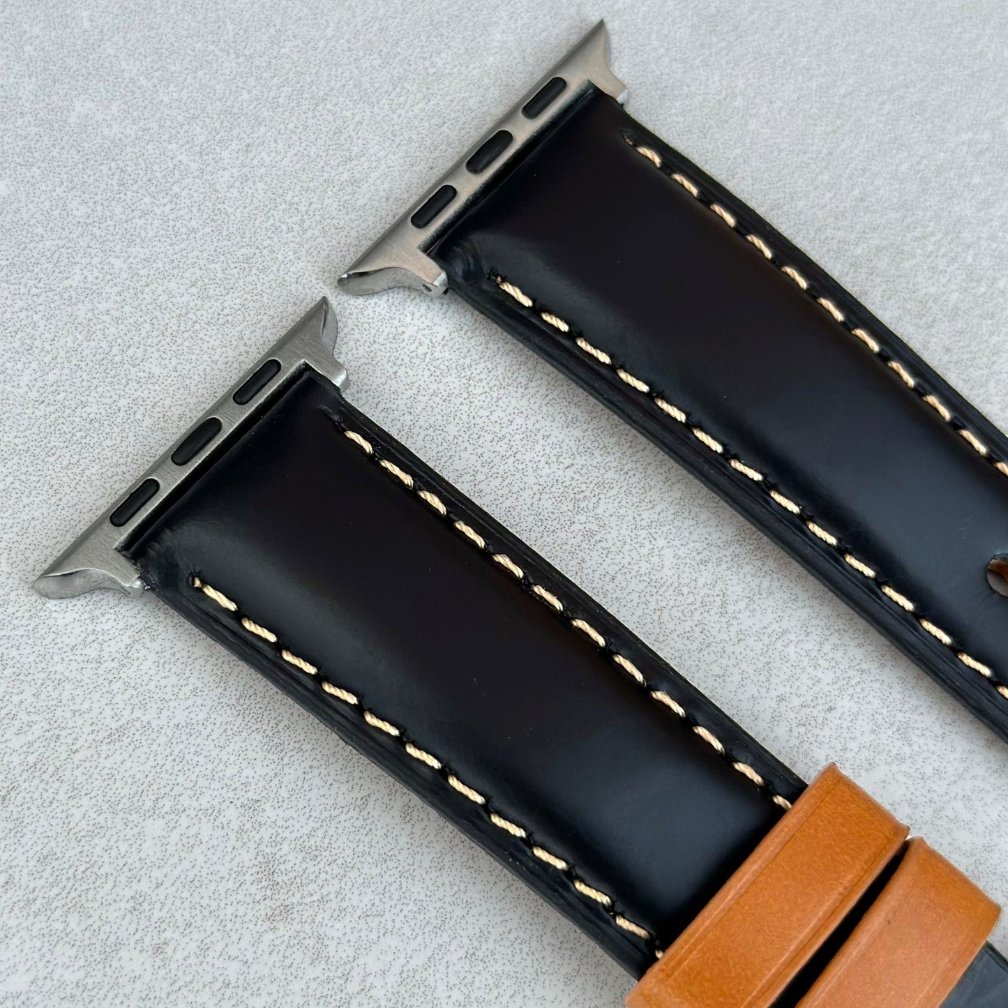 Top of the Oxford black full grain leather Apple Watch strap. Padded leather Apple Watch strap. Contrast ivory stitching.