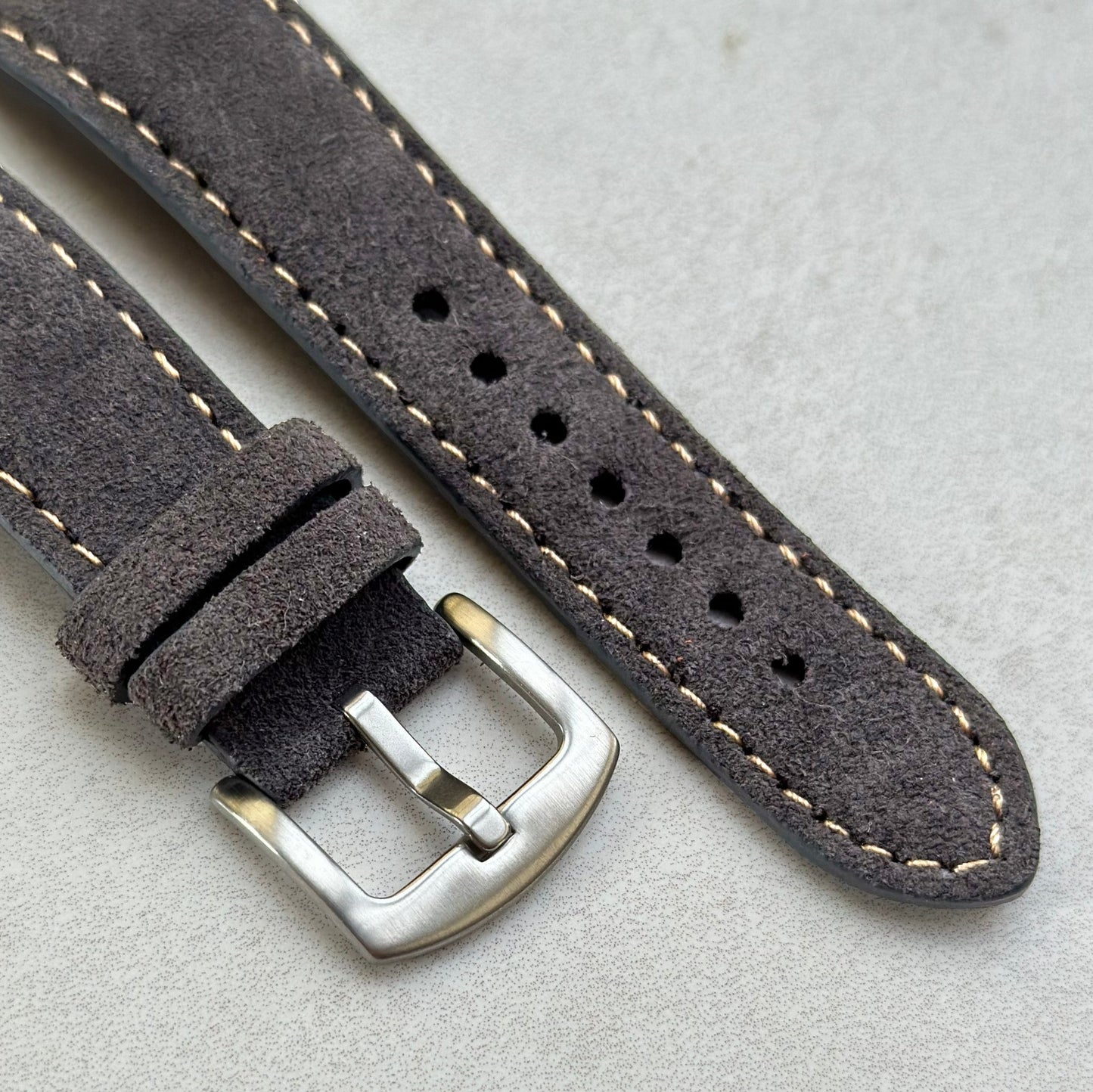 Brushed 316L stainless steel buckle on the Paris gunmetal grey suede watch strap. Contrast ivory stitching. Watch And Strap.