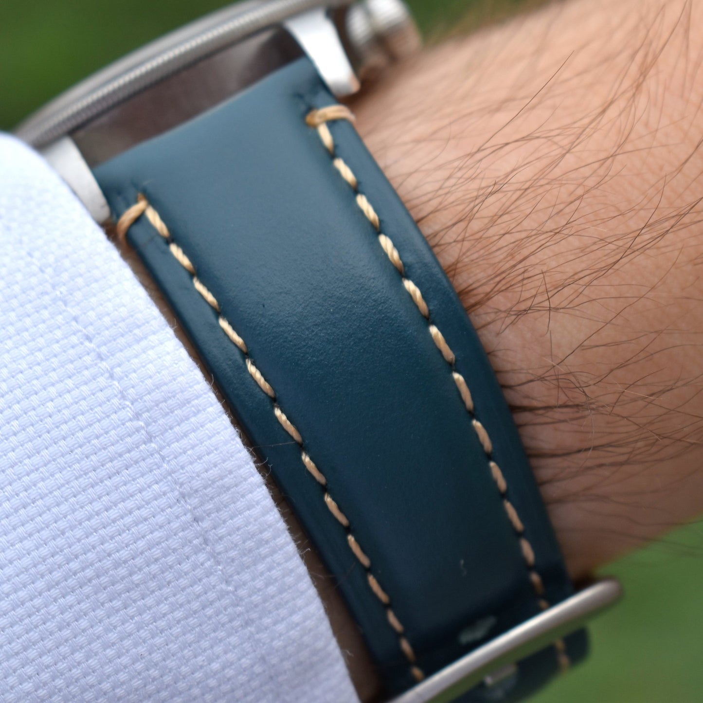 Wrist shot of the Oslo petrol blue full grain leather watch strap. Placed on a Tudor Blackbay 58 on a males wrist.