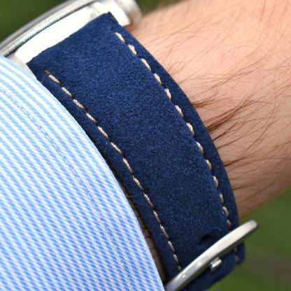 Paris navy blue suede watch strap placed on a males wrist. Contrast ivory stitching, padded leather watch strap.